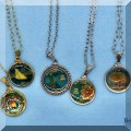 J31. Enameled state quarter necklaces. 
